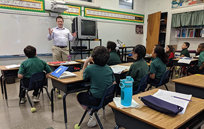 Sam Lollar speaks to chlidren in Jamaica