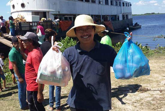 Fr. Lan gets shipments of food each week