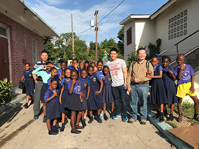 Sam Lollar with Jamaican Catholic school children