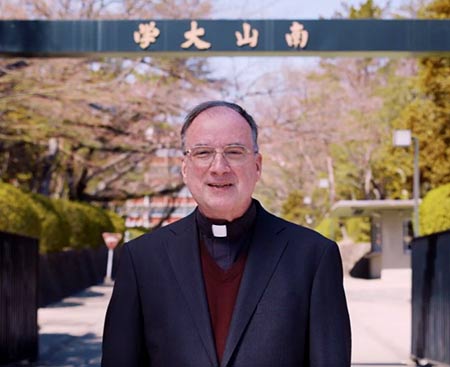 Fr Bob Kisala SVD standing outside Nanzan University in Japan