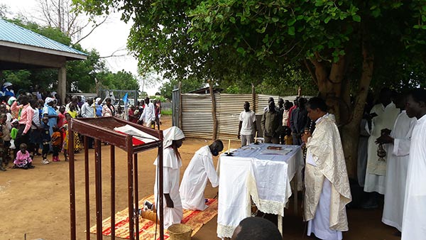 Priest celebrating Mass in an African village