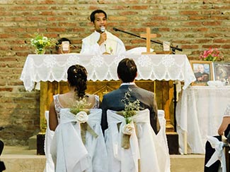 Fr. Kornlius Nika presiding at a Catholic wedding