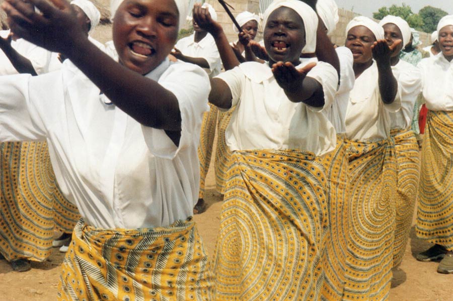 Group of African women dancing for joy