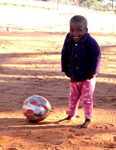 Small child with soccer ball