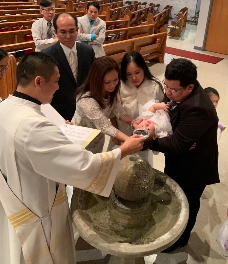 Deacon Bau Nguyen, SVD, celebrates the sacrament of baptism for the first time