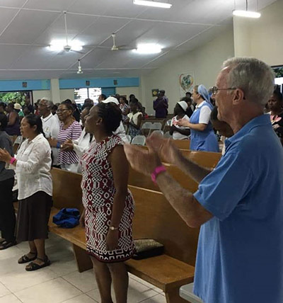 Fr. Frank Power, SVD, participates in Mass at a caribbean church