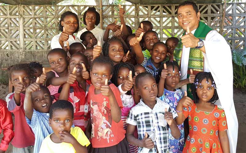 A group of youths is lead by a missionary