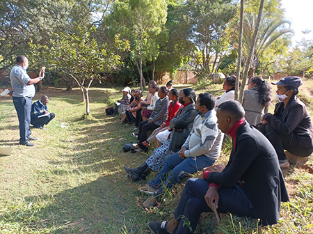 Teaching catechism to a group of local citizens in Madagascar
